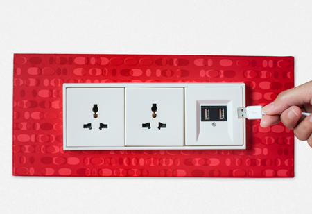 Woman hand plug USB Wall socket/outlet plate.の写真素材