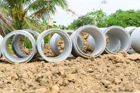 Concrete drainage pipes stacked for construction, irrigation, industry.の写真素材