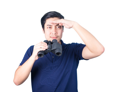 Asian handsome man holding binoculars in hands, isolated on a white background.の写真素材