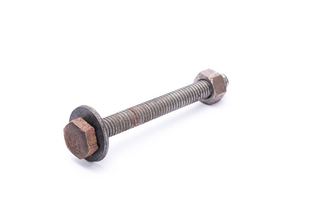 Old rusty steel bolt and nut with flat metal washer, isolated on white backgroundの写真素材