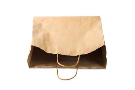 Empty blank brown paper bag isolated on white backgroundの写真素材