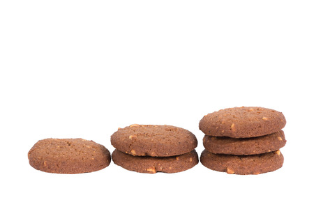 Chocolate cashew nut butter cookies stack isolated on white background with shadow.