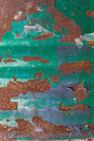 Old rusty green corrugated metal wall, background and textureの写真素材