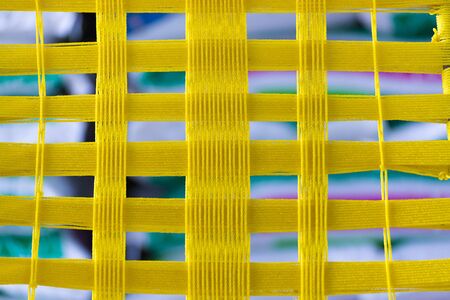 Yellow plastic rope weave.