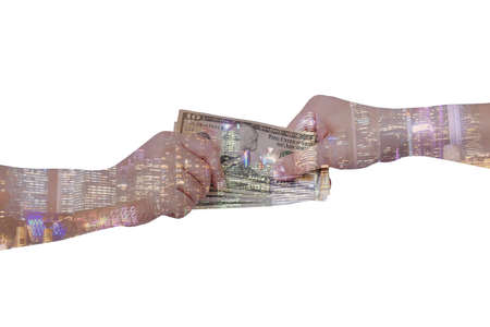 Double exposure of businessman hands exchanging money on city background with financial graph chart, business concept.の写真素材