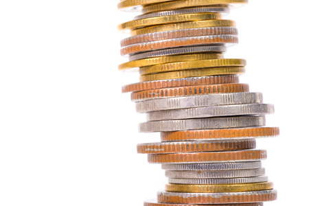 Columns of coins, piles of coins arranged on white background, business idea.の写真素材