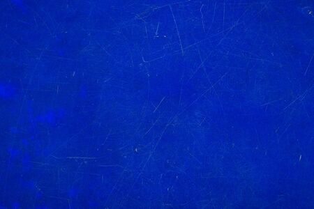 Abstract weathered natural scratched old blue plastic texture surface, used as a wallpaper or background.の写真素材