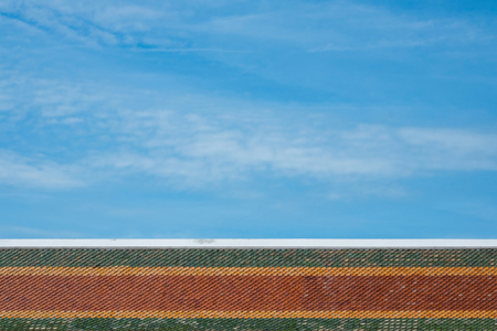 Roof tile texture in Theravada temple, Exterior of Thai Buddhist temple style, Traditional and architecture, rooftop pattern.の写真素材