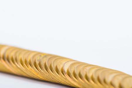 Columns of gold coins, piles of coins arranged on white background, business banking idea.の写真素材