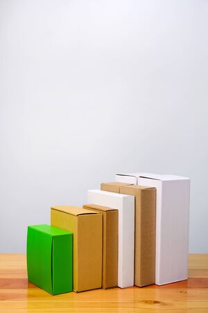 Group of cardboard box different color and size, pile of package made from paper for mock-up on...