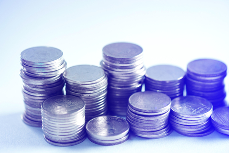 Piles of coins on working table with copy space, finance and business concept, shallow focus. soft tone.の写真素材
