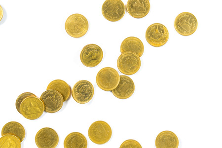 Top view of Falling gold coins money isolated on the white background, business wealth concept.の写真素材