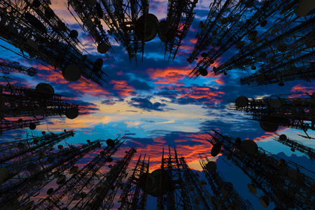 Silhouette of the antenna of cellular cell phone and communication system tower with Beautiful...