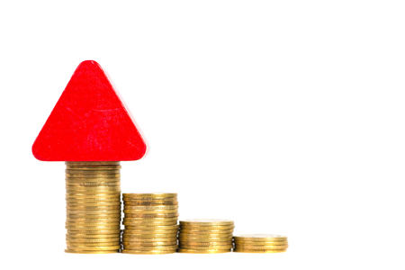 Model house wood form with step of coins stack isolated on white background, real estate investment and saving banking money finance concept.の写真素材