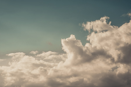 Deep blue sky and clouds, white cloud in the blue sky vintage tone.の写真素材