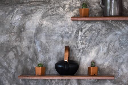 Concrete wall background texture grunge and grey surface with shelves and accessories, empty space for add text or image. Loft style interior design.の写真素材