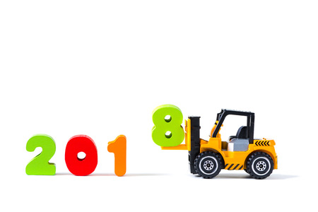Mini forklift truck loading text number eight to complete year 2018 word, isolated on white background with copy space, happy new year 2018 concept idea.の写真素材