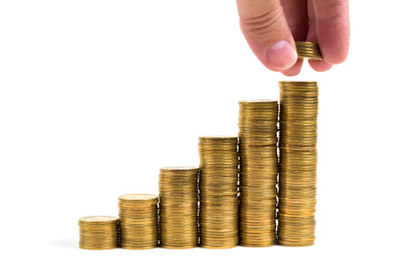 Hand put money coins to stack of coins isolated on white background, Money, Financial, Business...