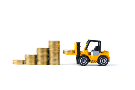 Mini forklift truck loading stack coin with steps of gold coin, isolated on white background with copy space, business finance and banking industrial concept idea.の写真素材