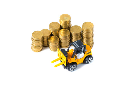 Mini forklift truck loading stack coin with steps of gold coin, isolated on white background with...