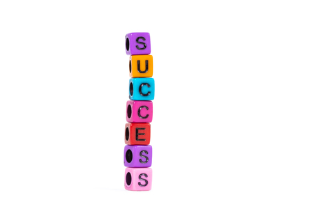 SUCCESS text made from colorful beads or letter bead on white background, finance and business...