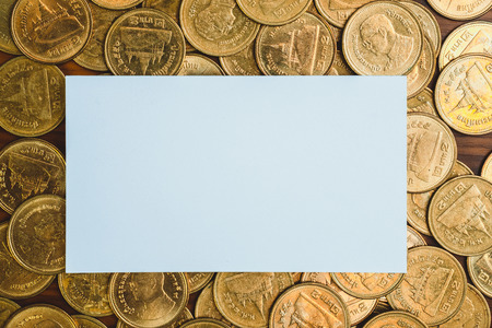 Blank business card or name card with copy space for add text name address and company logo, stack of coin on working table, financial company concept idea.の写真素材