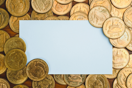 Blank business card or name card with copy space for add text name address and company logo, stack of coin on working table, financial company concept idea.の写真素材