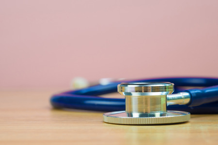 Stethoscope with blue tube on table, health and medical concept idea.の写真素材