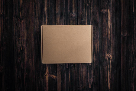 Top view of empty Package brown cardboard box or tray on wooden background, mock up for put productの写真素材