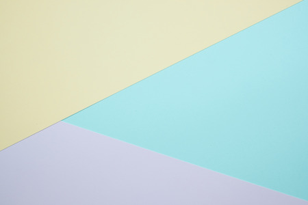 Fashionable  pastel colored paper flat lay top view, geometric background texture, pink, purple, yellow, beige, green and blue colour.の写真素材