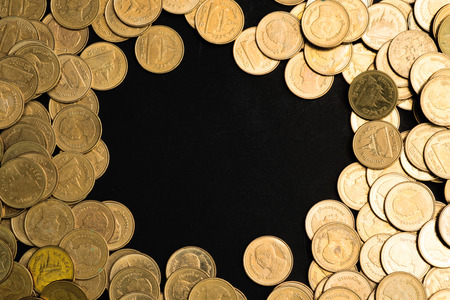 Savings, increasing columns of coins, piles of coins arranged as a graph in dark room, business...