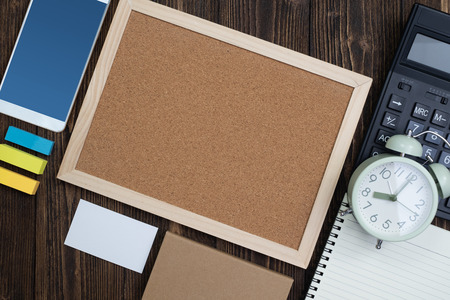 Office supplies or office work essential tools or items on wooden desk in workplace, top view with copy space for add text and message.の写真素材