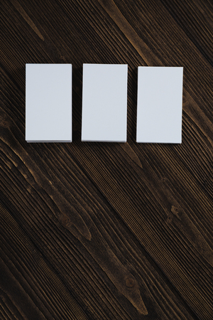 Blank business cards on wooden working table with copy space for add text ID. and logo, business...