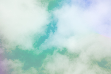 Sweet pastel colored cloud and sky with sun light, soft cloudy with gradient pastel color background. summer concept.の写真素材