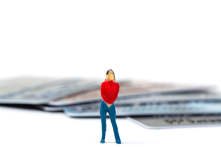 Shopping, fashion, banking and payment concept, figure miniature of smart woman standing or posts with stack of credit card.の写真素材