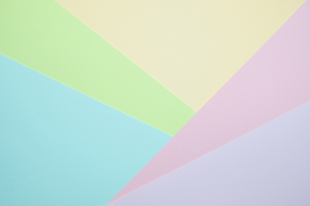 Fashionable  pastel colored paper flat lay top view, geometric background texture, pink, purple, yellow, beige, green and blue colour.の写真素材