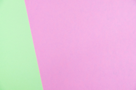 Pastel colored paper flat lay top view, background texture, green and pink colour.の写真素材