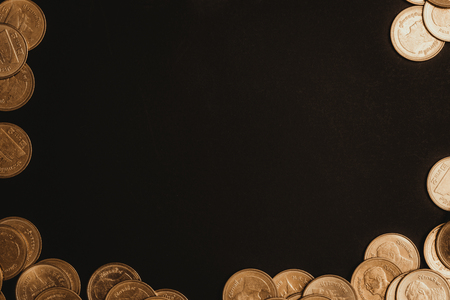 Savings, increasing columns of coins, piles of coins arranged as a graph in dark room, business banking concept ideaの写真素材