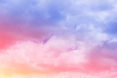 Sweet pastel colored cloud and sky with sun light, soft cloudy with gradient pastel color background. summer concept.の写真素材