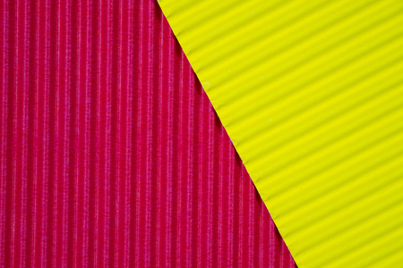 Red and yellow corrugated paper texture, use for background. vivid colour with copy space for add...