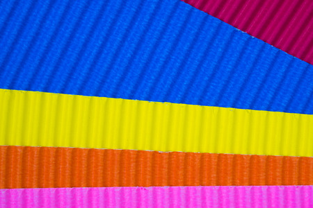 Multi coloured corrugated paper texture, use for background. vivid colour with copy space for add...