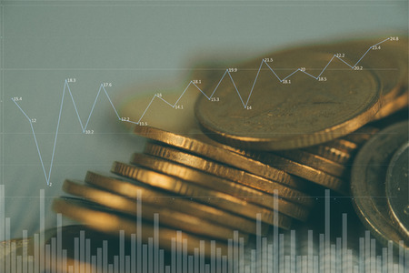 Double exposure Stack of coin with financial graph, business and financial concept idea.の写真素材