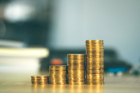 Coin stack office supplies or office work essential tools items on working table, business finance...