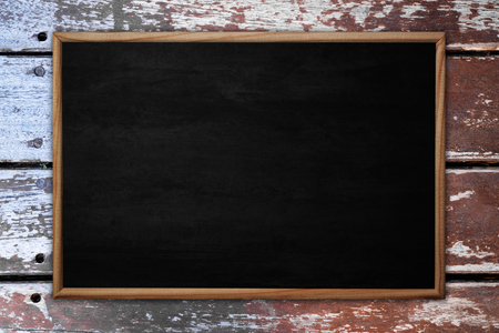 Abstract blackboard or chalkboard with frame on wooden background. empty space for add text.の写真素材