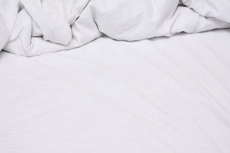 White delicate soft background of fabric or bedding sheet, background.