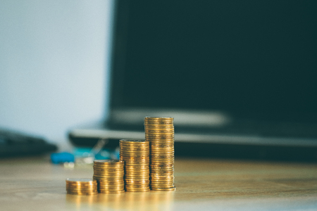 Coin stack office supplies or office work essential tools items on working table, business finance concept idea.の写真素材