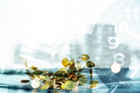 Falling gold coins money on office table with document cabinet background, business money and finance concept idea.の写真素材
