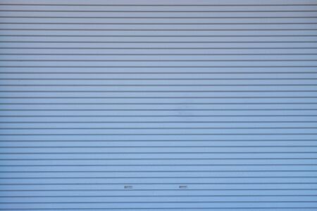 Metal roller shutter door or gate wall closed background and texture.