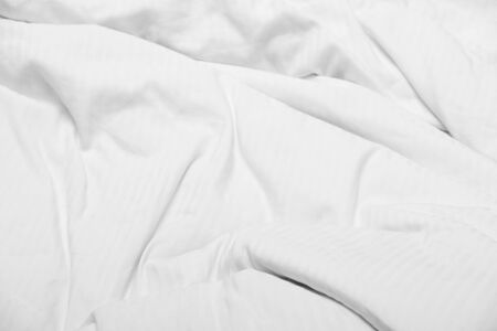 White delicate soft background of fabric or bedding sheet, background.
