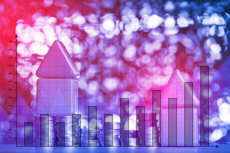 Double exposure of model house and stack of coins with financial graph, real estate investment and saving banking money finance concept.の写真素材